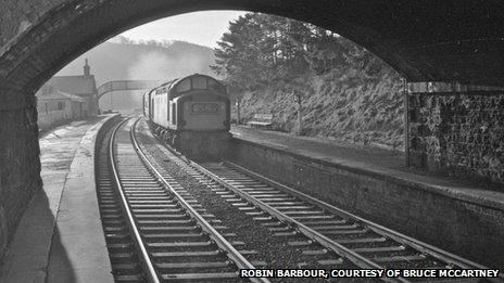 an English Electric Type 3 (aka Class 37) powers the 09.20 Carlisle-Edinburgh service non-stop through Stow in December 1968. Demonstrating the poverty of vision of local and central government, permission was given in the mid-1990s for a large bungalow to be built almost exactly where the locomotive is seen here. By the end of May 2012 the house had become, however, just a pile of rubble – awaiting the arrival of the new Borders Railway in 2015.