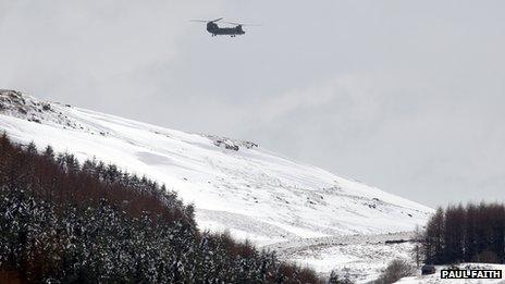 Chinook over snowy valley