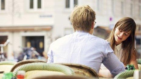 Man and woman sitting at table