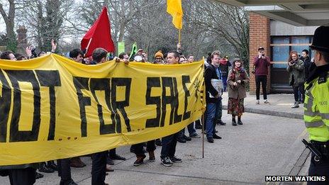 Protesters face police during Wednesday's peaceful protest at Sussex House