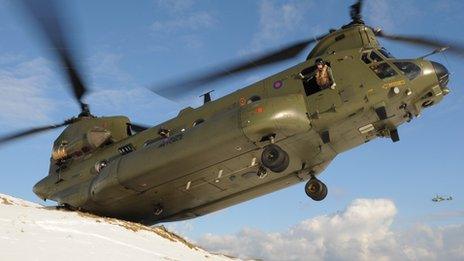 Military helicopter in operation during severe weather conditions in Northern Ireland