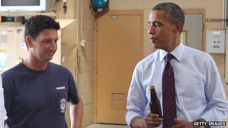 Barack Obama presents White House ale to firefighters