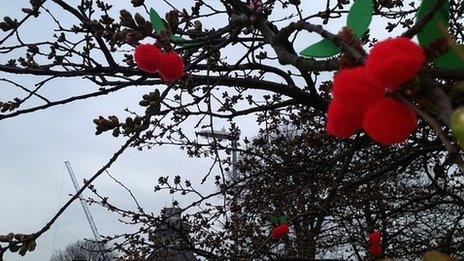 Knitted cherries on a tree