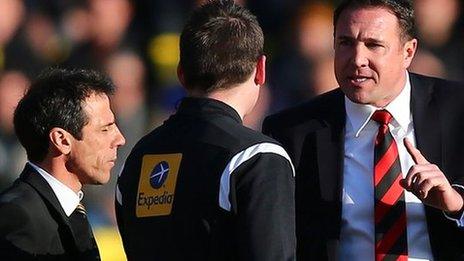 Cardiff City manager Malky Mackay reacts to fourth official Lee Collins as Watford boss Gianfranco Zola shuts his eyes to the issue