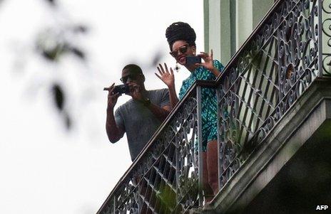 US singer Beyonce is seen on a balcony of the Saratoga Hotel in Havana next to her husband Jay Z, 5 April