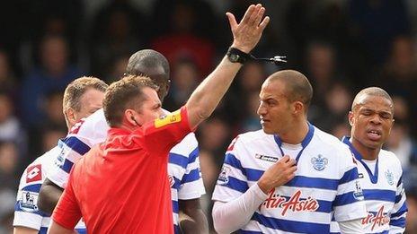 QPR striker Bobby Zamora reacts after his red card