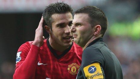 Robin van Persie with referee Michael Oliver