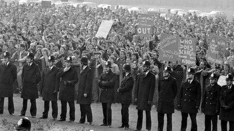 lines of policemen dividing the two factions involved in a "Right To Work" Rally by miners at the Nottinghamshire NUM Headquarters, Mansfield, during the year long miners strike of 1984.