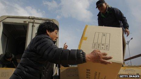 South Korean workers arrive with products from the Kaesong joint industrial complex in North Korea at the inter-Korean transit office in Paju, South Korea