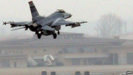 A US Air Force F-16C fighter jet lands on the runway during a military exercise at the Osan US Air Base in Pyeongtaek South Korea on 2 April 2013