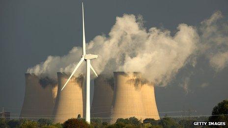 A wind turbine in front of a coal-fired power station near Selby, Yorkshire