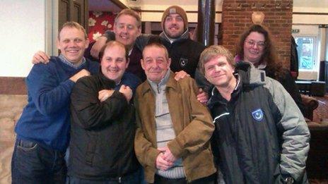 Tom Dearie (first from the left) and Carl Paddon (above wearing a hat) among other Pompey fans celebrating in the Shepherds Crook pub in Southsea