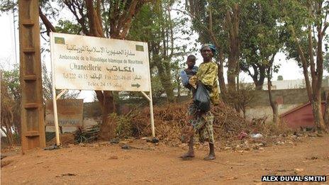 A woman carries her baby in Bamako, Mali