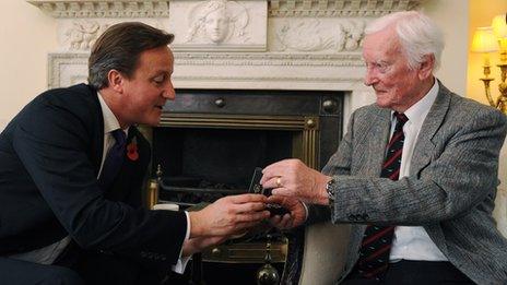 Leslie Valentine receiving the Defence Medal from Prime Minister David Cameron at 10 Downing Street