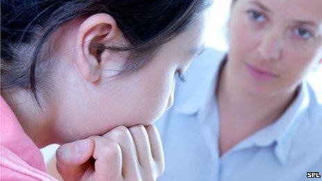 Teenager talking to a school nurse