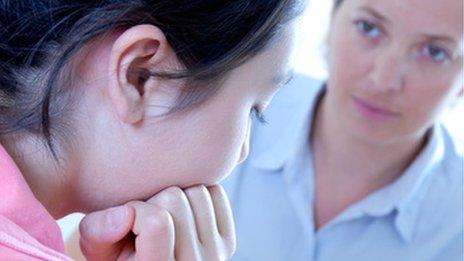 Teenager talking to a school nurse