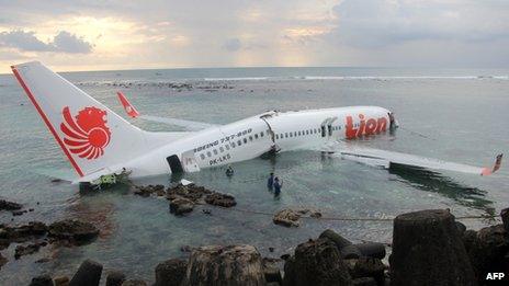 The crashed jet lies in water near Denpasar airport, Bali, 13 April