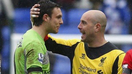 Reading goalkeeper Alex McCarthy with Liverpool's Pepe Reina