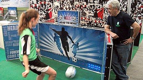 Kevin Keegan watches youngster playing Sokka game