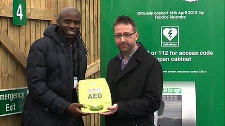 Fabrice Muamba and Mark Mapp with Guernsey's first public access defibrillator