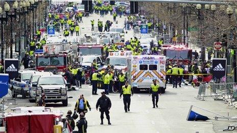 Police clear the area at the finish line of the 2013 Boston Marathon following explosions