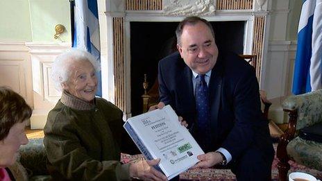 Rhona Weir giving petition to Alex Salmond