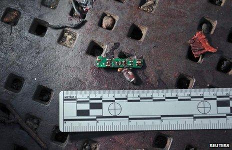 A Boston Marathon bomb scene picture taken by investigators shows the remains of an explosive device, 16 April