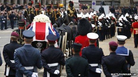 The coffin is carried on a gun carriage drawn by the King's Troop Royal Artillery