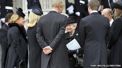 The Queen speaks to the Thatcher family. Lady Thatcher was the eighth prime minister during the Queen's reign.