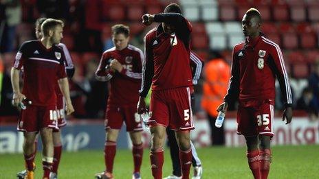 Bristol City players leave the field after their relegation