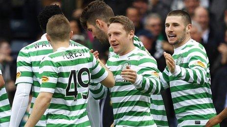 Kris Commons is congratulated by his Celtic team-mates