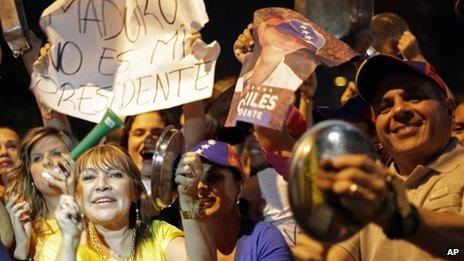 Supporters of opposition leader Nicolas Maduro use pots and pans to protest Nicolas Maduro's win in Sunday's presidential election