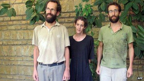 Former French hostages Tanguy Moulin-Fournier, his wife Albane and his brother Cyril pose at the French embassy in Yaounde on 19 April 2013