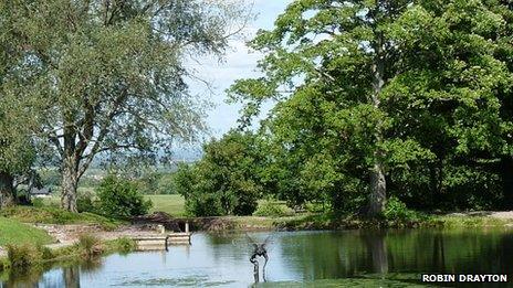 One corner of the lock pound that is adjacent to the Fourteen Locks Canal Centre. The dragonfly sculpture