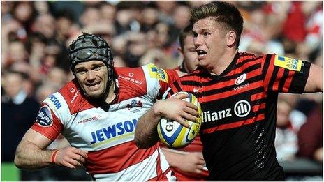 Saracens fly-half Owen Farrell takes on the Gloucester defence