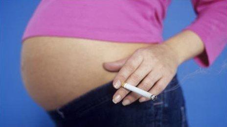 Pregnant woman with cigarette