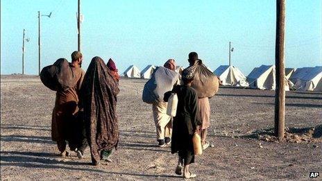 A group of Afghan refugees arrive at an Iranian Red Crescent refugee camp near the border with Iran, October 2001