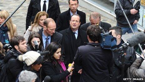 Francois Hollande in the middle of a media scrum