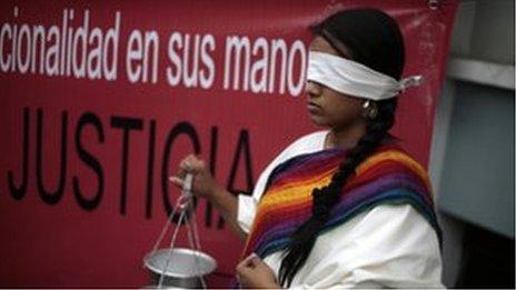 A protester outside court on 20 April 2013