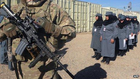 Female Afghan National Police (ANP) march during a graduation ceremony at a police training centre in Herat (December 2012)
