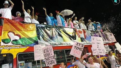 Same-sex marriage advocates partake in the rain-soaked Sydney Mardi Gras Parade on 3 March 2012