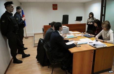 Court officials and lawyers attend the NGO hearing in Moscow, 25 April