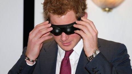 Prince Harry trying on goggles at Headway