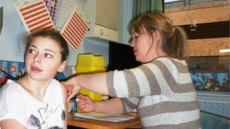 Sophie Hayes, 13, from Townhill, Swansea, receives MMR from Health Visitor Jo Lamb.