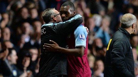 Aston Villa manager Paul Lambert embraces Christian Benteke