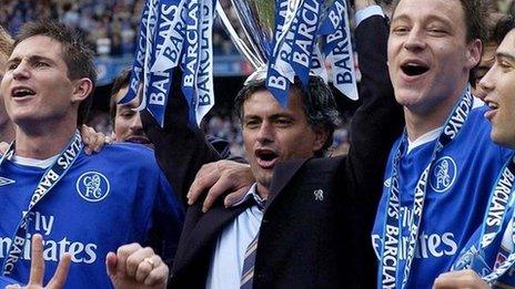 Jose Mourinho lifts the Premier League trophy