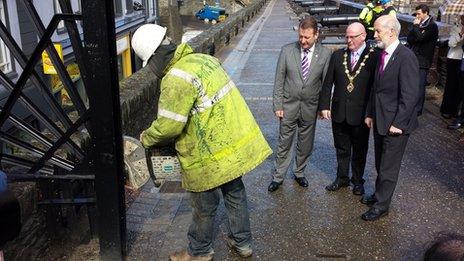 City centre manager Jim Roddy, mayor Kevin Campbell and Justice Minister David Ford watch as security gates are removed