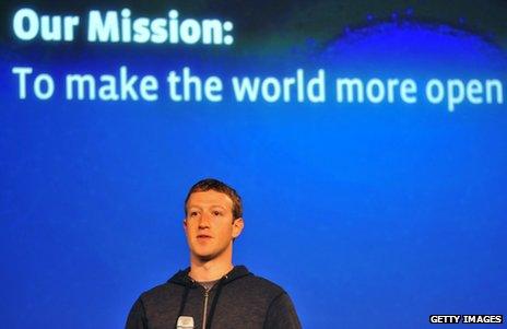 Facebook CEO Mark Zuckerberg against a backdrop reading: "Our Mission: To make the world more open"