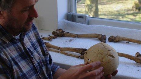 Tim Sutherland examining the skull