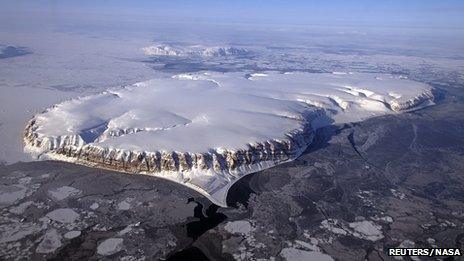 Saunders Island and Wolstenholme Fjord with Kap Atholl in the background is shown in this picture taken during an Operation IceBridge survey flight in April 2013